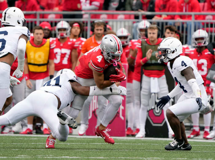 Former Ohio State receiver Julian Fleming catches a pass against Penn State at Ohio Stadium in 2023. Fleming will play for the Nittany Lions in 2024.